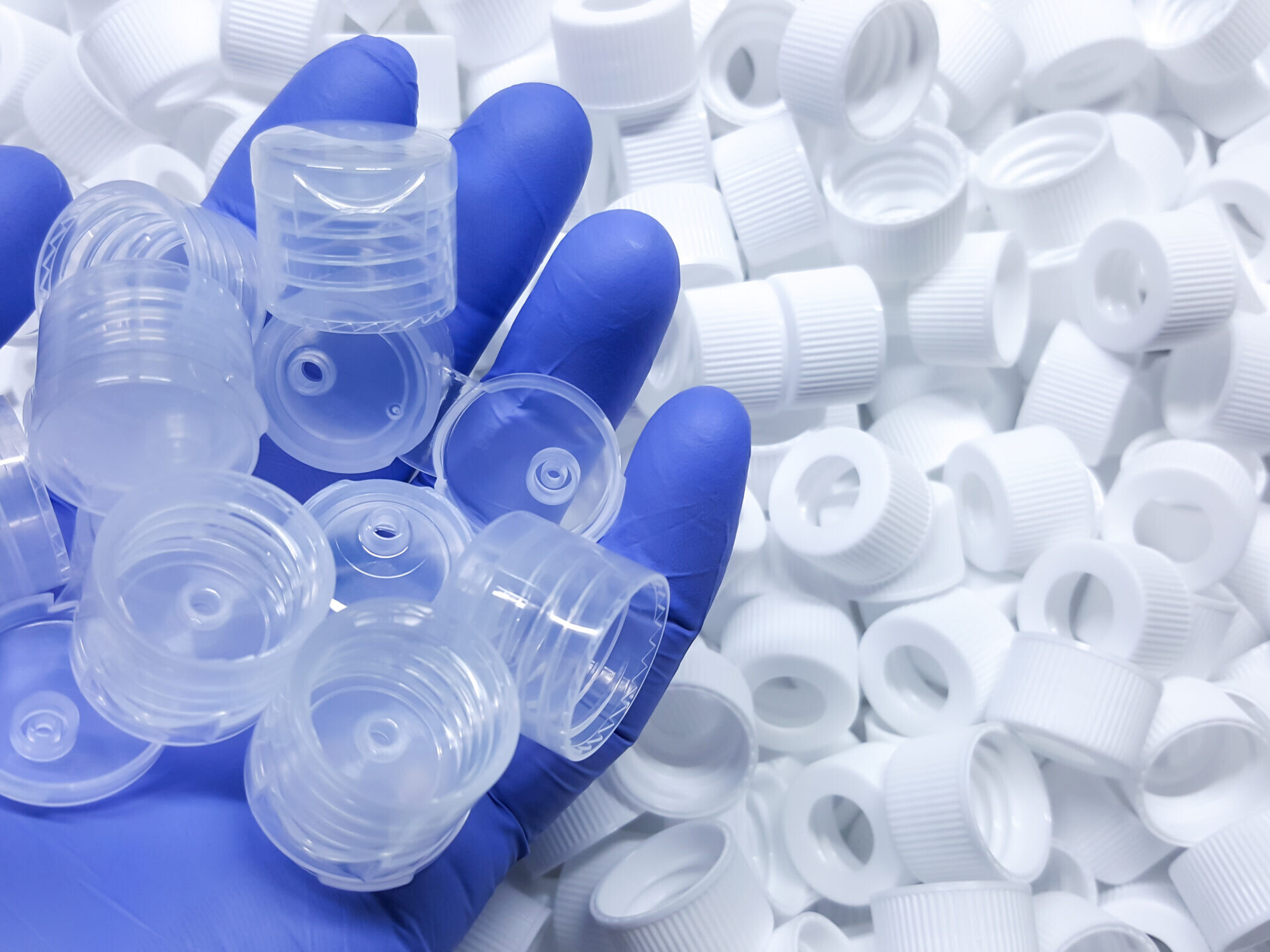 White Medical plastic bottle caps. Made from injection molding machine, of the manufacturing and assembly department, In the plastics industry