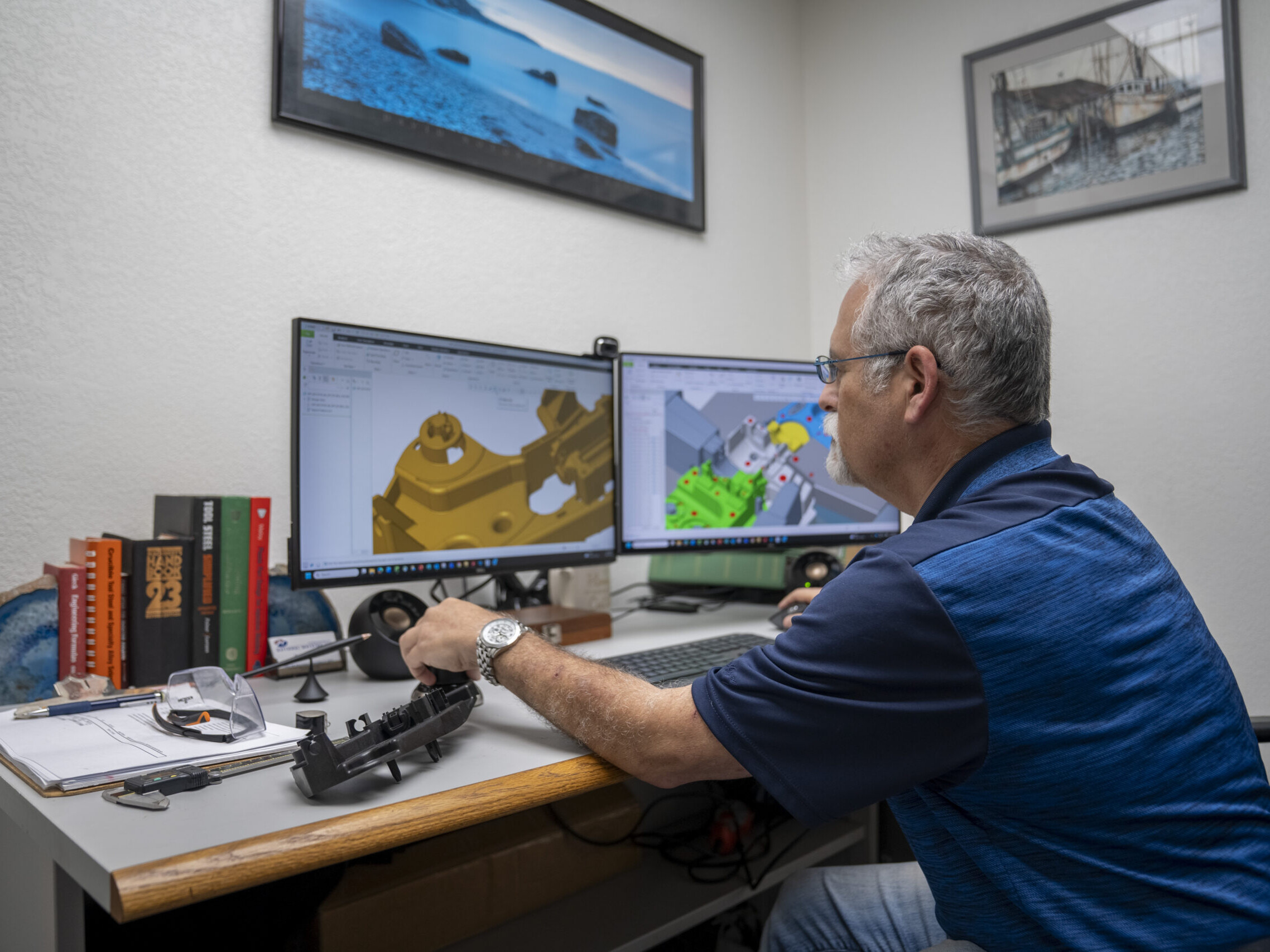 man designing plastic part on computer