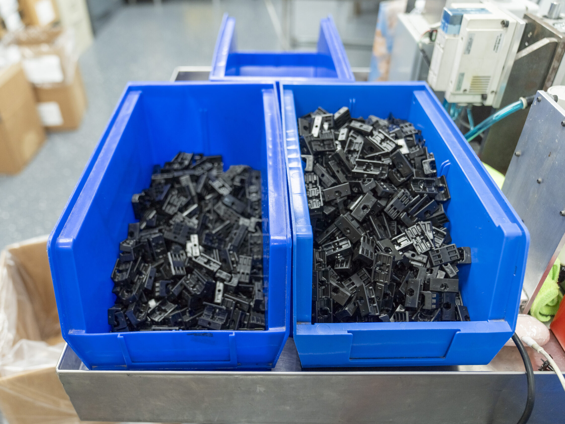 small plastic pieces sitting in bins